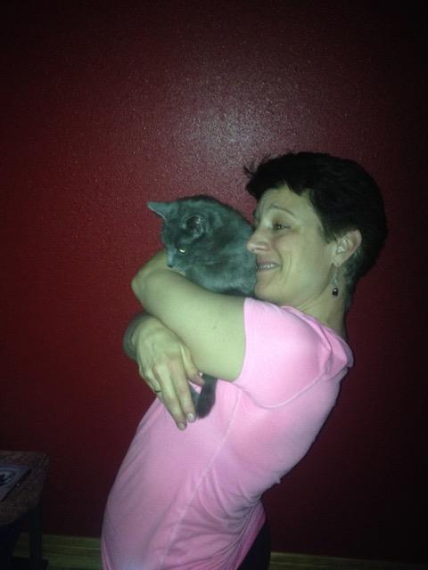 Sue with kitty at yoga